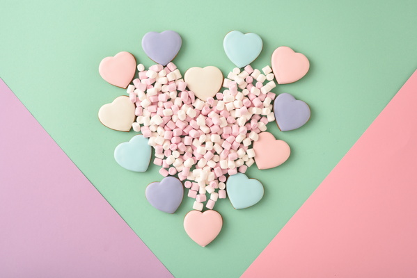 Heart-Shaped Cookies with Marshmallow Lie on Multicolored Background